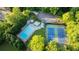 Community aerial shot featuring a sparkling pool and well-maintained tennis courts, perfect for active lifestyles at 170 Mark Nw Trl, Sandy Springs, GA 30328