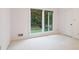 This bedroom features a carpet floor and natural light from the window at 170 Mark Nw Trl, Sandy Springs, GA 30328