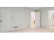 Spacious bedroom with neutral tones, walk-in closet, and access to an ensuite bathroom at 170 Mark Nw Trl, Sandy Springs, GA 30328