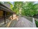 The large, inviting deck is perfect for enjoying the surrounding nature and sunlight through the glass door at 170 Mark Nw Trl, Sandy Springs, GA 30328