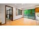Bright kitchen adjacent to dining area with sliding glass doors to the outdoor deck at 170 Mark Nw Trl, Sandy Springs, GA 30328