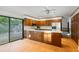 A well-appointed kitchen with wood cabinets, stainless steel appliances, and access to an outdoor deck area at 170 Mark Nw Trl, Sandy Springs, GA 30328