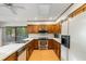 A well-organized kitchen showcasing wood cabinets, stainless steel appliances, and a bright, functional layout at 170 Mark Nw Trl, Sandy Springs, GA 30328