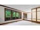 Bright living room with large windows offering scenic views of the surrounding greenery at 170 Mark Nw Trl, Sandy Springs, GA 30328