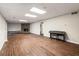 A spacious living area with laminate flooring, a fireplace, and recessed lighting at 170 Mark Nw Trl, Sandy Springs, GA 30328