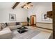Cozy living room with vaulted ceiling, wood beams, and stylish décor at 170 Mark Nw Trl, Sandy Springs, GA 30328