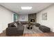 This living room boasts a sectional sofa, modern fireplace, and wood flooring at 170 Mark Nw Trl, Sandy Springs, GA 30328