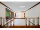 Bright loft area with skylight, hardwood floors, and large windows overlooking the landscape at 170 Mark Nw Trl, Sandy Springs, GA 30328