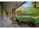 Stone porch with pillars, beautifully framed by lush greenery, enhancing curb appeal and outdoor living at 170 Mark Nw Trl, Sandy Springs, GA 30328