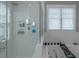 Glass-enclosed shower and separate soaking tub featuring white subway tile at 1914 Coal Pl, Atlanta, GA 30318