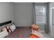 Cozy bedroom with neutral decor, lots of natural light and comfortable furniture at 1914 Coal Pl, Atlanta, GA 30318