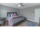 Bedroom features a decorative rug, ceiling fan, and well-coordinated furnishings at 1914 Coal Pl, Atlanta, GA 30318