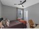 Bedroom features a ceiling fan, natural light, and neutral colors at 1914 Coal Pl, Atlanta, GA 30318