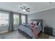 Bedroom showcasing windows, grey walls, crown molding and a ceiling fan at 1914 Coal Pl, Atlanta, GA 30318