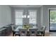 Elegant dining room with a modern table, stylish chairs, and ample natural light at 1914 Coal Pl, Atlanta, GA 30318