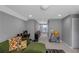Open hallway with carpet, gray walls, and a glimpse of natural light creates an inviting and clutter-free space at 1914 Coal Pl, Atlanta, GA 30318