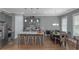Bright and airy kitchen with gray cabinets, a large island, and open dining area perfect for gatherings at 1914 Coal Pl, Atlanta, GA 30318