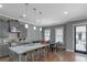 Modern kitchen with a large island, stainless appliances, and a breakfast bar at 1914 Coal Pl, Atlanta, GA 30318