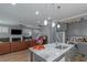 Modern kitchen featuring a marble island, stainless steel appliances, and open-concept living area at 1914 Coal Pl, Atlanta, GA 30318