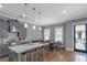 Stylish kitchen featuring a spacious island, stainless appliances, and a seamless flow into the dining area at 1914 Coal Pl, Atlanta, GA 30318