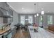 Open-concept kitchen with an island, stainless steel appliances, and modern cabinetry at 1914 Coal Pl, Atlanta, GA 30318