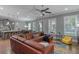 Open-concept living space with a modern kitchen, comfortable seating, and abundant natural light at 1914 Coal Pl, Atlanta, GA 30318