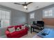 Home office with natural light, two desks, a cozy sofa, and neutral decor at 1914 Coal Pl, Atlanta, GA 30318