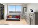 Bright bedroom with a large window overlooking a city skyline, paired with modern furnishings at 2479 Peachtree Rd # 601, Atlanta, GA 30305