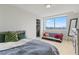 Bright bedroom with hardwood floors and a view of the city skyline at 2479 Peachtree Rd # 601, Atlanta, GA 30305