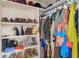 Organized closet featuring shelves with shoes and hanging clothing for ample storage at 2479 Peachtree Rd # 601, Atlanta, GA 30305