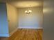 A simple dining room space with hardwood flooring and a chandelier at 2479 Peachtree Rd # 601, Atlanta, GA 30305
