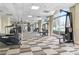 Well-equipped gym featuring various exercise machines and large windows at 2479 Peachtree Rd # 601, Atlanta, GA 30305