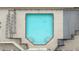 Aerial view of a rectangular swimming pool with ladder access, surrounded by a fence and patio at 2479 Peachtree Rd # 601, Atlanta, GA 30305