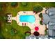 A bird's eye view of the landscaped backyard and kidney-shaped pool at this well-appointed property at 1415 N Flat Rock Rd, Douglasville, GA 30134