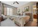 Charming bedroom featuring twin beds, neutral tones, and natural light from a large window with blinds at 1415 N Flat Rock Rd, Douglasville, GA 30134