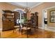 Elegant dining room with hardwood floors, chandelier, and a large window for natural light at 1415 N Flat Rock Rd, Douglasville, GA 30134