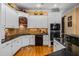 Modern kitchen featuring granite countertops, white cabinetry, and stainless steel appliances at 1415 N Flat Rock Rd, Douglasville, GA 30134