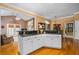 Open kitchen with granite countertops, white cabinets, and stainless steel sink at 1415 N Flat Rock Rd, Douglasville, GA 30134