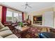 Inviting living room with large windows, comfortable seating, and a decorative rug, perfect for relaxation and entertainment at 1415 N Flat Rock Rd, Douglasville, GA 30134