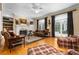 Spacious living room with hardwood floors, fireplace, and multiple seating areas at 1415 N Flat Rock Rd, Douglasville, GA 30134