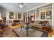 Inviting living room with plush seating, hardwood floors, and decorative artwork at 1415 N Flat Rock Rd, Douglasville, GA 30134