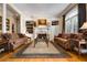 Bright living room featuring a fireplace, hardwood floors, and custom built-in shelving at 1415 N Flat Rock Rd, Douglasville, GA 30134