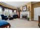 Cozy main bedroom featuring a fireplace, sitting area, and elegant decor with natural light at 1415 N Flat Rock Rd, Douglasville, GA 30134
