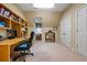 Home office with built in shelving, large desk, and double closets at 1415 N Flat Rock Rd, Douglasville, GA 30134