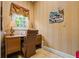 Cozy home office featuring a wooden desk, a comfortable chair, and natural light at 1415 N Flat Rock Rd, Douglasville, GA 30134
