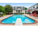 An in-ground swimming pool, patio with lounge chairs, and a diving board at 1415 N Flat Rock Rd, Douglasville, GA 30134