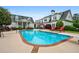 An in-ground swimming pool, patio with lounge chairs, and a view of the large white house at 1415 N Flat Rock Rd, Douglasville, GA 30134