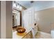 Bathroom featuring a stylish vessel sink, decorative mirror, and tile flooring at 1615 Mount Mckinley Dr, Grayson, GA 30017
