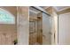Elegant bathroom features a glass door shower with tile surround and chrome fixtures at 1615 Mount Mckinley Dr, Grayson, GA 30017