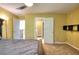 Bedroom showcasing a queen bed and open access to a large ensuite bathroom at 1615 Mount Mckinley Dr, Grayson, GA 30017